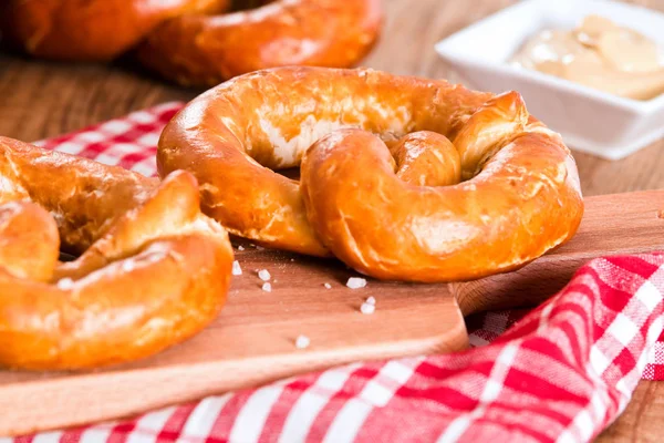 Bavarian pretzels on cutting board. — Stock Photo, Image