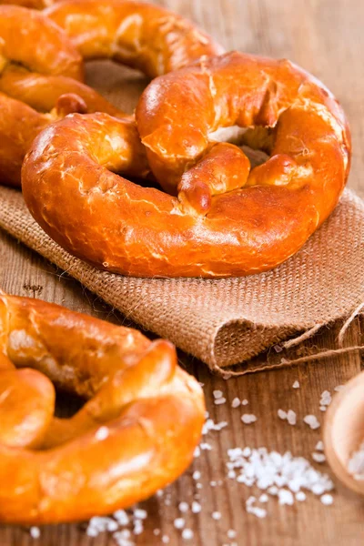 Bavarian pretzels on wooden table. — Stock Photo, Image
