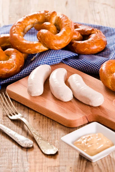 Bavarian pretzels with beer and sausage. — Stock Photo, Image