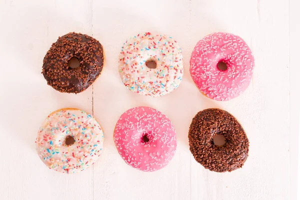 American donuts on wooden table. — Stock Photo, Image