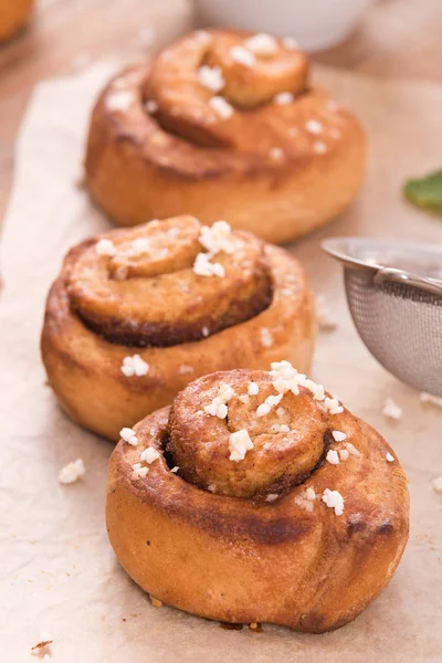 Cinnamon rolls on wooden table. — Stock Photo, Image