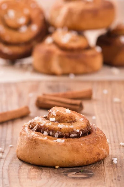 Cinnamon rolls on wooden table. — Stock Photo, Image