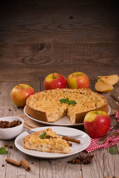 Crumble apple cake on white dish.