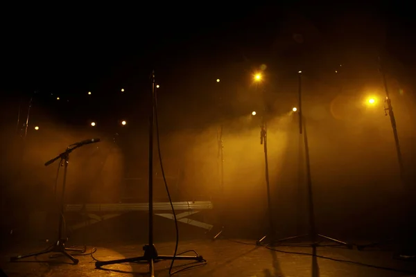 Empty concert stage with microphones and lighting in Paris