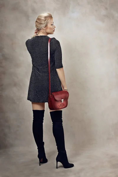woman with red shoulder bag