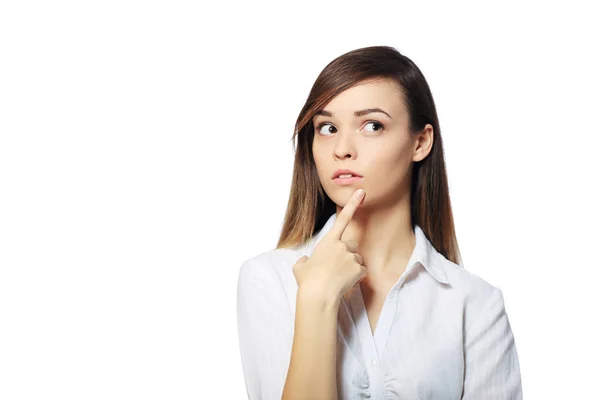 Young woman holding finger on chin — Stock Photo, Image