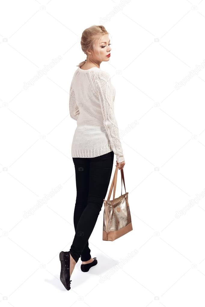  woman walking with shoulder bag