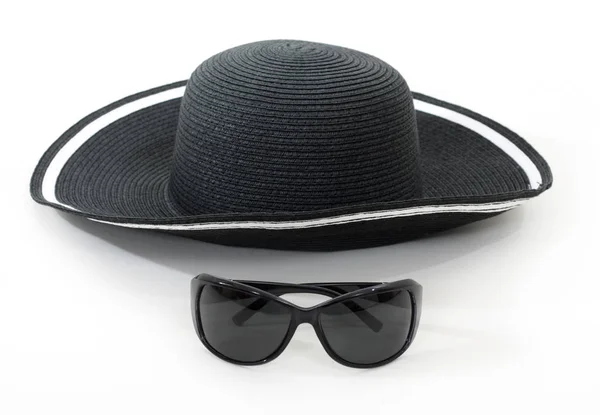 Black hat and glasses — Stock Photo, Image