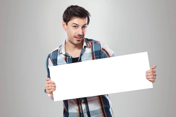 Man holding blank sheet — Stock Photo, Image