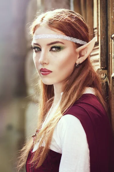 Elf girl in red cloak — Stock Photo, Image