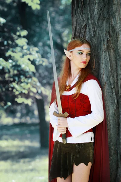Elf girl in red cloak — Stock Photo, Image