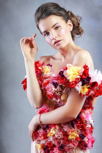 Woman in dress of flowers — Stock Photo, Image