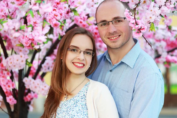 Couple hugging while standing outside — Stock Photo, Image