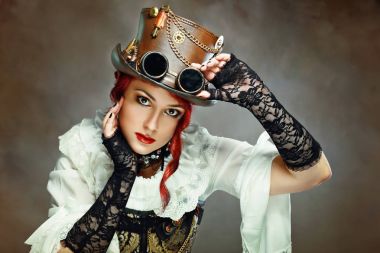 Portre güzel Victorian tarzı kız giyiyor Steampunk şapka