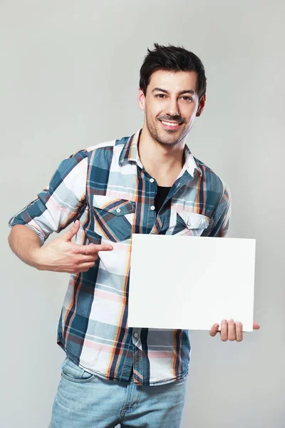 Smiling Handsome Young Man Hold White Card — Stock Photo, Image