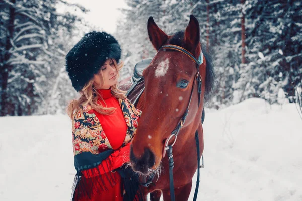 Portrait of a beautiful girl and handsome stallion, horse in the winter on the nature — Stock Photo, Image