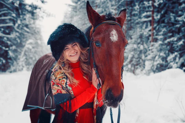Portrait of a beautiful girl and handsome stallion, horse in the winter on the nature — Stock Photo, Image