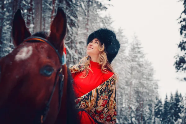 Portrait of a beautiful girl and handsome stallion, horse in the winter on the nature — Stock Photo, Image