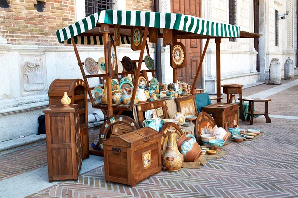 Village fair vintage Handicrafts. Pottery, leather and wooden objects on table. — Stock Photo, Image