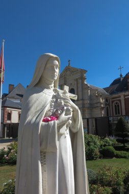 Statue of St. Therese of the Child Jesus on the square in front  clipart
