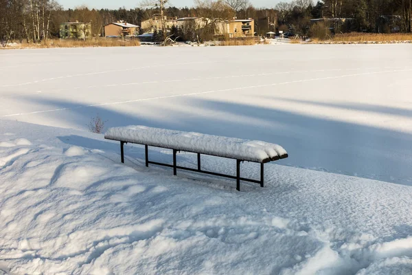 Bench covered with snow — Stock Photo, Image