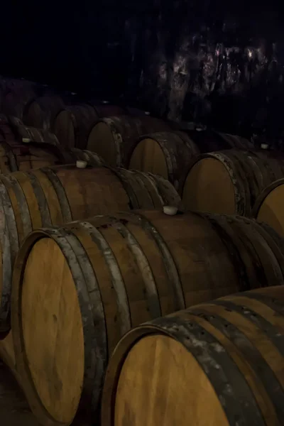 Wine barrels drilled in the basement — Stock Photo, Image