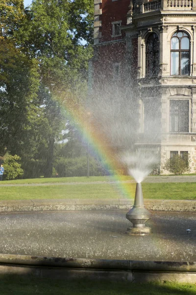 Rainbow in the fountain in the park of the palace and park compl — Stock Photo, Image