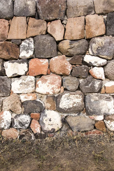 Una pared de grandes piedras apiladas como — Foto de Stock