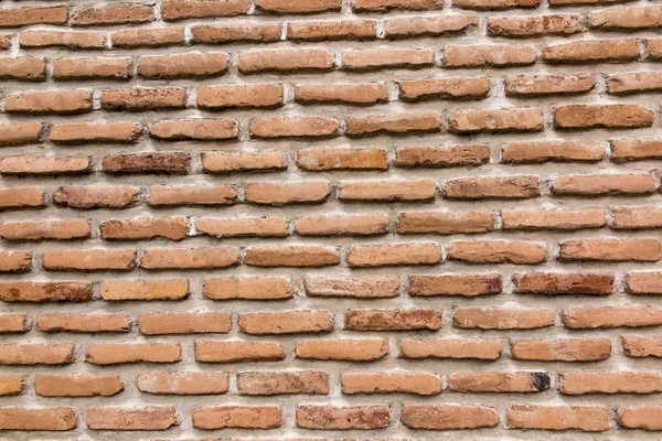 Brick wall with a large layer of mortar — Stock Photo, Image