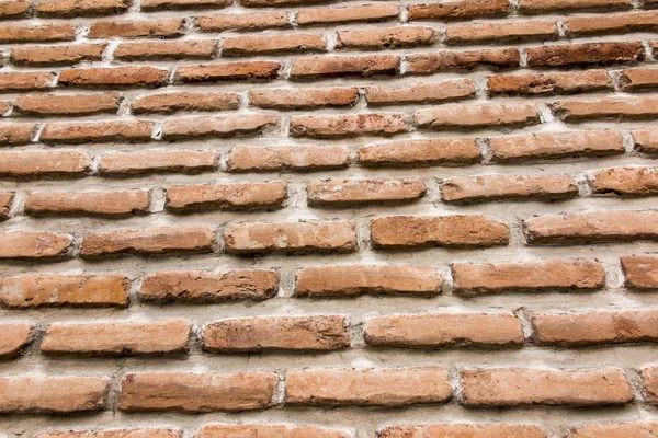 Brick wall with a large layer of mortar — Stock Photo, Image