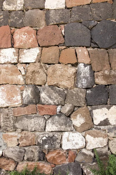 A wall of stacked large stones as — Stock Photo, Image