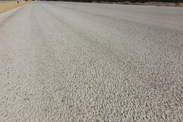 Superfície pavimentada de uma nova estrada não utilizada — Fotografia de Stock