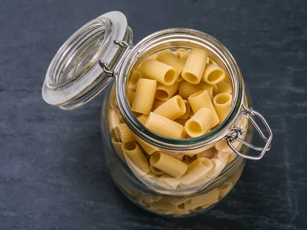 Mezzi Rigatoni pasta in a jar — Stockfoto