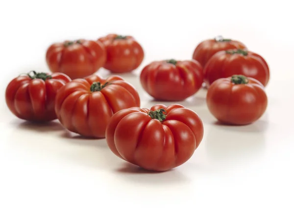 Marmande tomatoes on white table — Stock Photo, Image