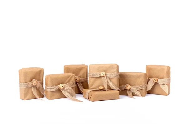 Gift box for Christmas wrapped in brown recycled paper — Stock Photo, Image