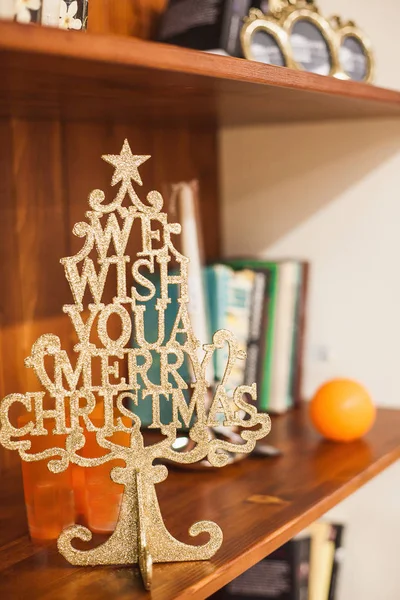 Decorative wooden christmas tree on a shelf — Stock Photo, Image
