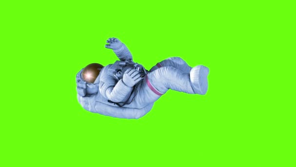 Astronaut rotating isolated on green background — Stock Video