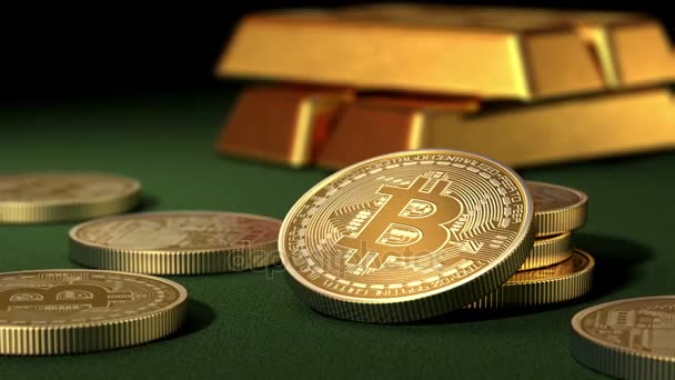 Bitcoins y lingotes de oro en una mesa verde — Vídeos de Stock