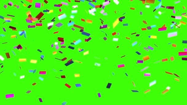 Confetti cae sobre un fondo verde — Vídeos de Stock
