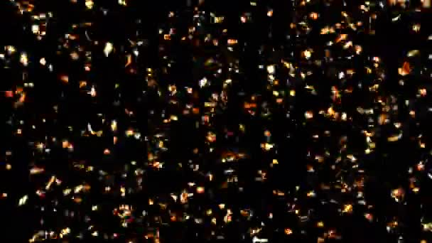 Lentamente cayendo Golden Confetti sobre un fondo verde y negro — Vídeos de Stock