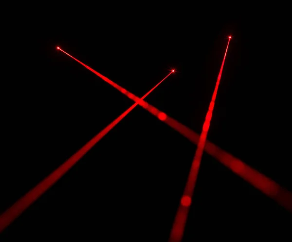 Červené laserové paprsky — Stock fotografie
