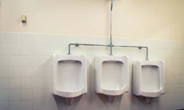 Three urinals bathroom — Stock Photo, Image