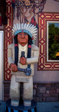 Wooden Indian in front of a store