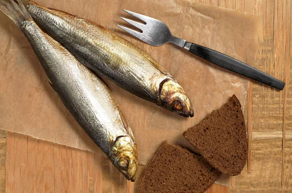 Smoked fish on table — Stock Photo, Image