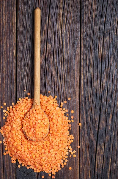 Red lentils in spoon — Stock Photo, Image