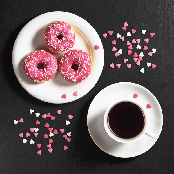 Pink donuts and coffee