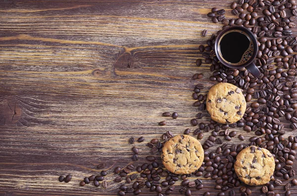 Xícara de café, feijão e biscoitos — Fotografia de Stock