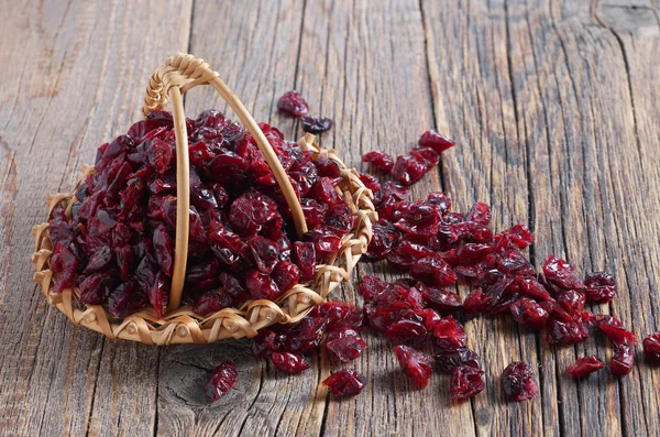 Dried cranberries in wicker basket — Stock Photo, Image