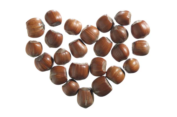 Hazelnuts in shape of heart — Stock Photo, Image