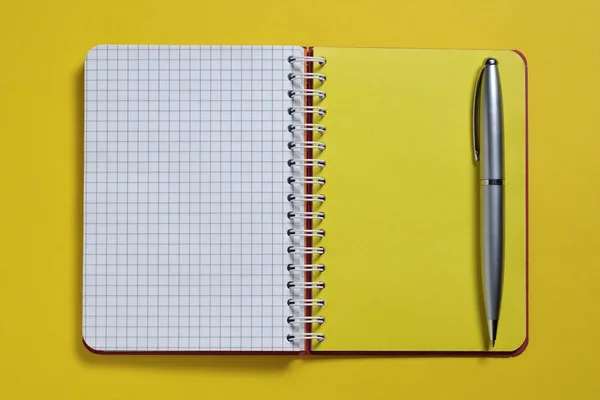 Notebook Pen Yellow Background Close Top View — Stock Photo, Image